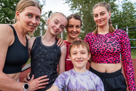 Happy family and friends taking a selfie after workout