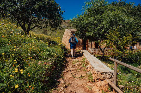 Man approaching visitor center in Zingaro Nature Reserve, Sicily