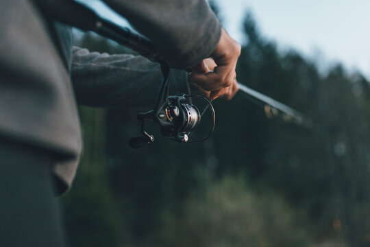 Close up of man holding fishing rod