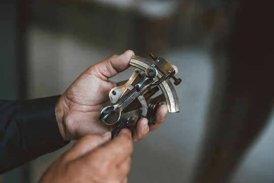 Senior man holding measuring tool