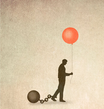 Silhouette of man restrained by ball and chain holding balloon symbolizing hope