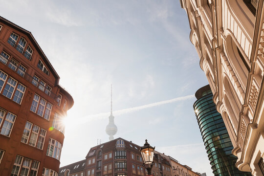 Germany, Berlin, buildings at Rosenthaler Strasse with television tower in the background at morning