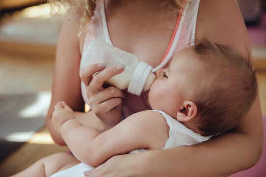 Mother bottle-feeding her baby