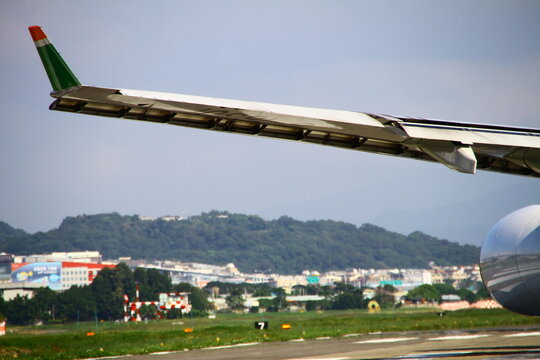 An airplane wing extension with winglet on the runway.