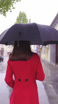 Woman walk in the rain