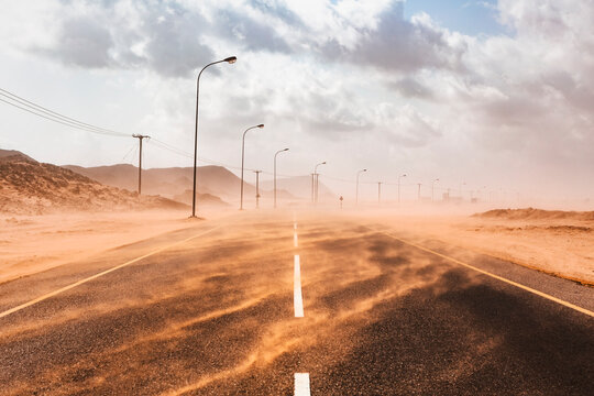 Sultanate Of Oman, Ras al Hadd, Desert road in a sand storm