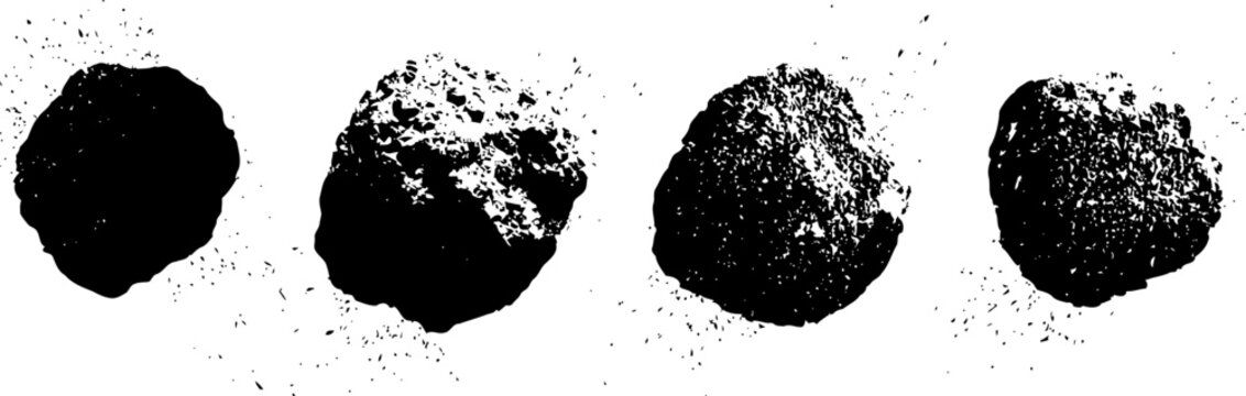 Four black charcoal briquettes with ash powder isolated on white background