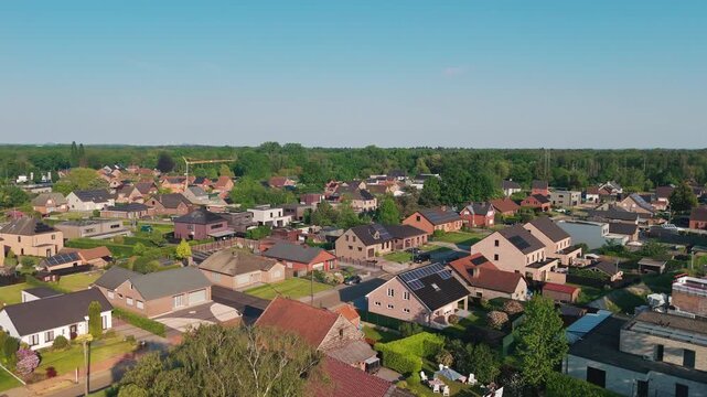 Aerial drone view of countryside neighborhood in Heusden-Zolder Belgium, picturesque suburban residential area, green rural landscape, peaceful village living.