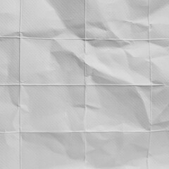 Fototapeta premium Crumpled grid paper texture background in grayscale