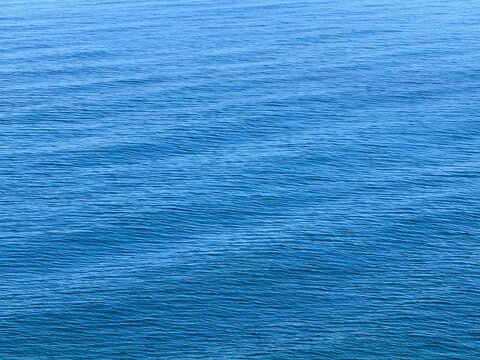 Blue sea water with ripples background