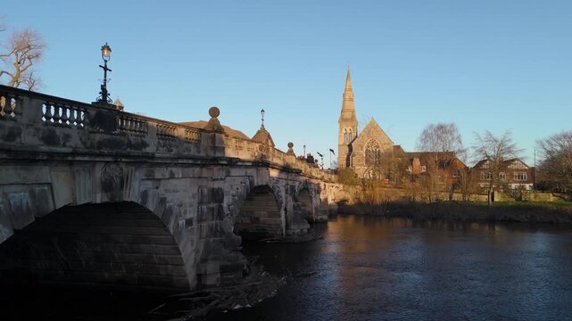 Pigeons in Flight Over English Bridge and River Severn with Church Spire, Shrewsbury