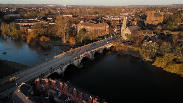 Pigeons in Flight Over English Bridge and River Severn with Church Spire, Shrewsbury
