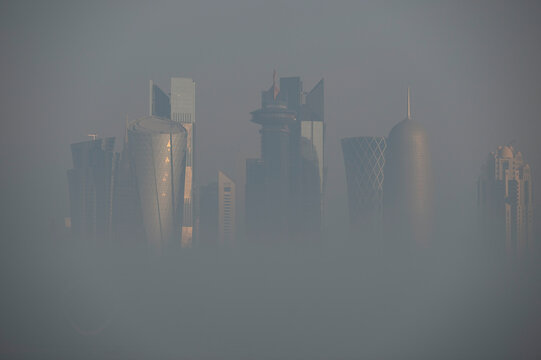 Doha Aerial view of West bay Doha during fog, hazy and mist weather in Qatar 	