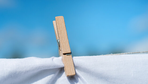 Clothespin Holding Linen Fabric on Clothesline