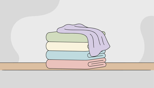 Neat stack of folded pastel colored laundry blankets and towels resting on a wooden shelf with a clean background.