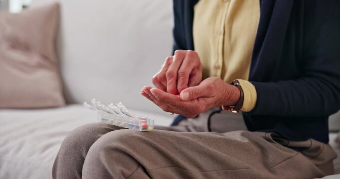 Retirement, sorting or hands in home with pillbox, treatment plan or schedule in wellness. Medication, dosage or old person with container, prescription organizer or drug routine in health management