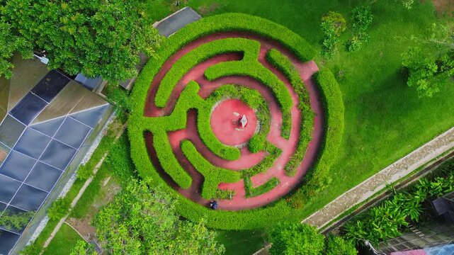 Aerial view of the circular hedge maze at Rumah Ulin Arya in Kecamatan Samarinda Utara, Kalimantan Timur, Indonesia.