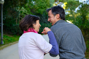 Fototapeta premium couple sharing a happy moment laughing outdoors