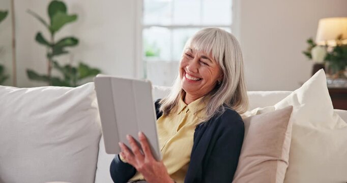 Old woman, relax and laugh on sofa with tablet, streaming and browsing website for film. Smile, senior person or comedy with digital app, download ebook and multimedia for movies subscription in home