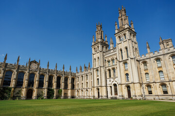 Fototapeta premium All Souls College cloister facade on green lawn courtyard, UK