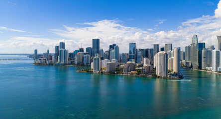 Obraz premium Miami Brickell skyline with iconic towers near bay. Miami aerial cityscape with skyline and coastline. Miami downtown skyline with financial buildings. Miami seaside skyline with oceanfront view.