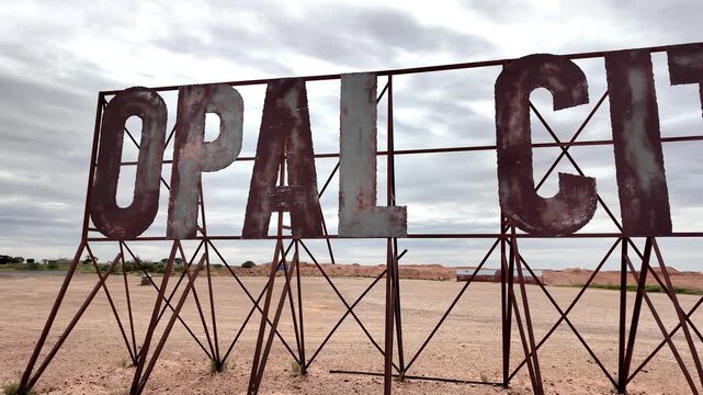 Iconic Rusted Metal Opal City Welcome Sign at the Entrance to Coober Pedy, South Australia Outback