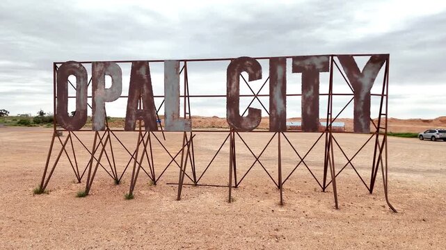 Iconic Rusted Metal Opal City Welcome Sign at the Entrance to Coober Pedy, South Australia Outback