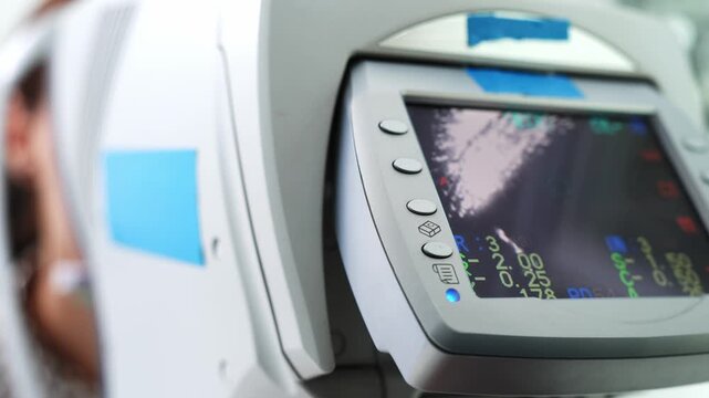 Detailed view of a medical monitor showcasing vital signs in a clinical environment for patient care