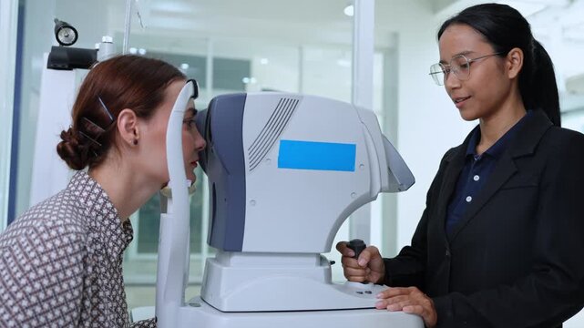 Eye care professional assessing a patient's vision using advanced testing tools in a contemporary clinic environment
