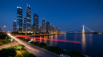 Fototapeta premium Nighttime Cityscape Featuring Bright Skyscrapers, a Red Bridge, and Reflective Waterfront.