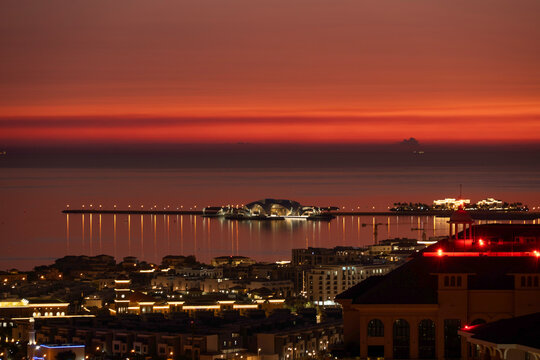 Sunrise Aerial view of Porto Arabia Peral Qatar. Artificial island	