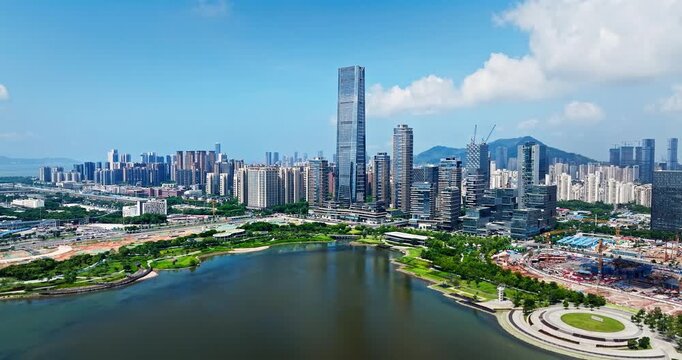 Modern skyscrapers and urban park with a lake in Shenzhen, China