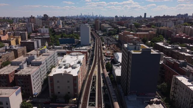 4 subway train over Jerome Ave. in the Bronx moves towards NYC skyline