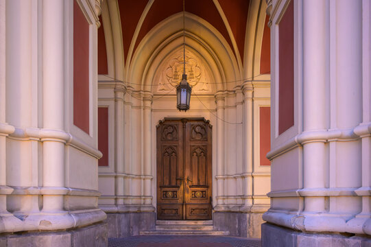 Gothic Portal and Carved Wooden Door of the Name of Mary Church