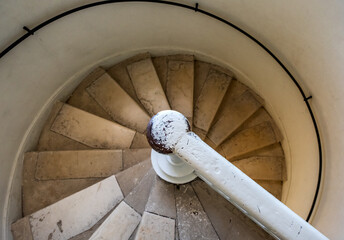Fototapeta premium Old spiral staircase. Old spiral wooden staircase inside the lighthouse