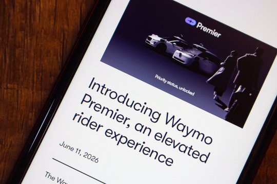 Mexico City, MEXICO - Jun 25 2026 : Smartphone displaying the Waymo blog announcement titled Introducing Waymo Premier, an elevated rider experience, with hero image of autonomous vehicles.