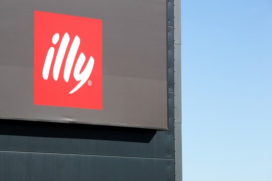 Horsens, Denmark - March 15, 2025:  Illy logo on a signboard. Illy is an Italian coffee roasting company that specializes in the production of espresso
