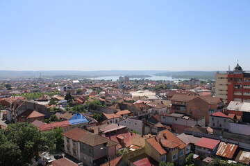 Fototapeta premium View of the city of Drobeta-Turnu Severin, Romania, from above. Seen from the top of the water castle. The city lies on the Danube, which is here the border river between Romania and Serbia. Europe.