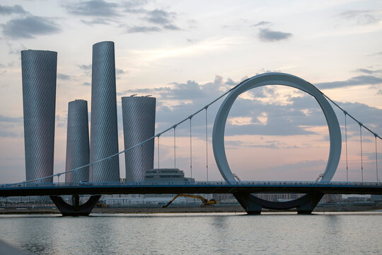 Plaza Tower Lusail with Arch Bridge sunset time	