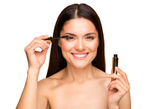 Closeup photo of attractive latin naked lady model holding eyelash bottle applying one eye making night makeup preparing date isolated beige pastel color background