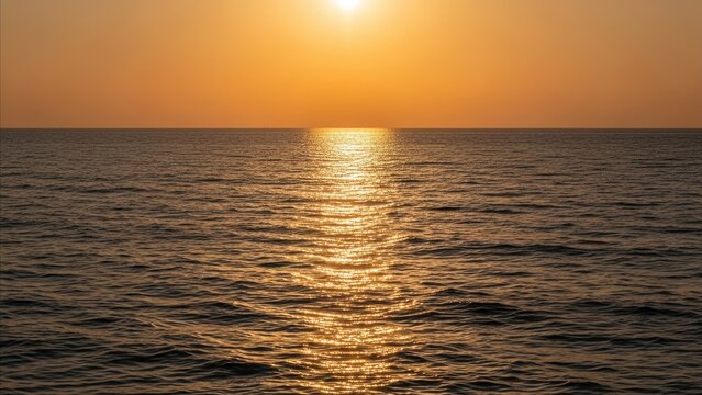 Nature - Golden Sunset Reflecting on Calm Ocean Surface with Bright Sun on Clear Orange Sky
