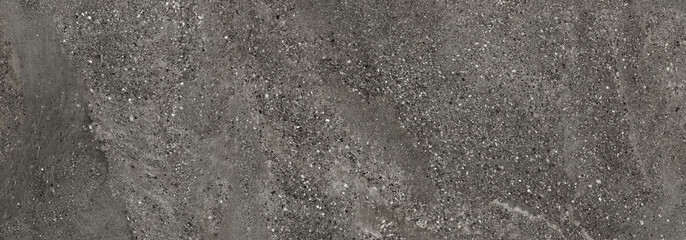 Black terrazzo texture with natural stone particles and beach sand inspired earthy surface pattern. Rustic architectural background with warm neutral tones. © Vidal