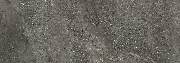 Black terrazzo texture with natural stone particles and beach sand inspired earthy surface pattern. Rustic architectural background with warm neutral tones. © Vidal