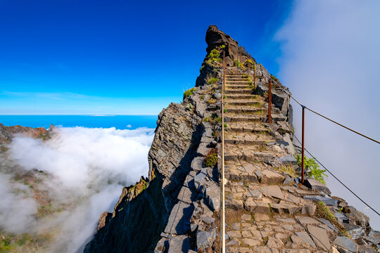 Ninho da Manta &ndash; a scenic trail near the summit of Pico do Arieiro on the island of Madeira, Portugal. A legendary mountain trail with steep cliffs on both sides of the path. A picturesque panorama.