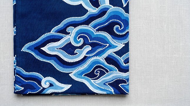 Traditional Blue Mega Mendung Batik Pattern Textile from Indonesia on Neutral Background, Cultural Heritage Fabric Art for Fashion Design and Asian Craftsmanship Concept