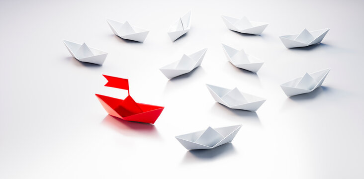 Group of  white paper boats with red leader in the middle on white background - 3D illustration