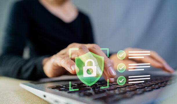Cybersecurity concept with person typing on laptop, data protection shield icon and online checklist