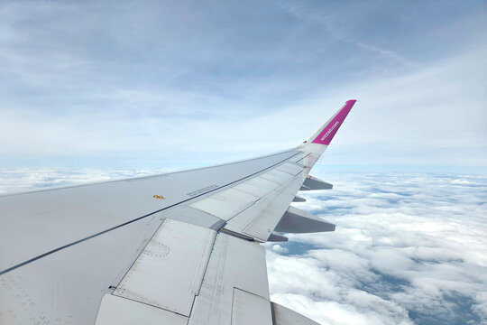 Basel, Switzerland, May 22, 2026: Aerial View from Airplane Wing in Bright Sky for Travel Imagery