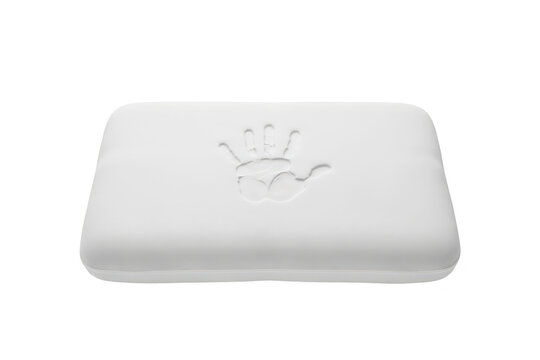 A white rectangular memory foam pillow featuring a distinct handprint indentation on its surface, isolated on a white background, view