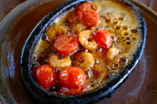 Karides tava, traditional Turkish fried shrimp dish with tomatoes, close-up